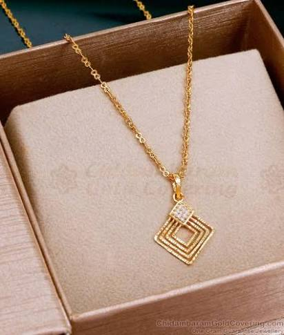 Gold pendant set in display box
